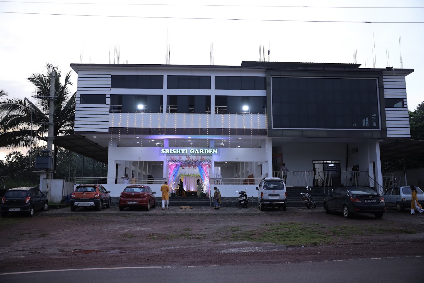 Srishti Garden building at dusk with wedding lighting